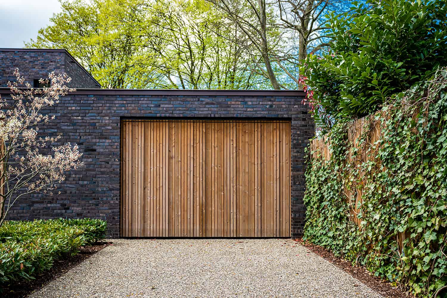 wide-garage-door-and-concrete-driveway-in-front